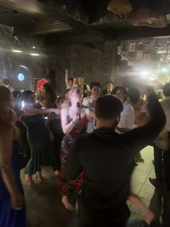 The crowd dancing on the floor at Cavo, with the stone stairs behind